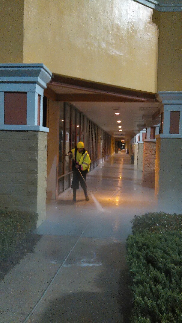 Pressure washing service on commercial shopping center