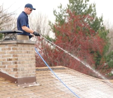 Roof soft washing service in progress